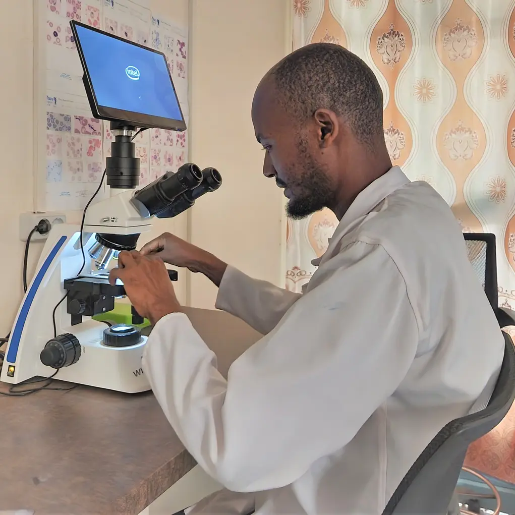 lab tech mohammod with microscope